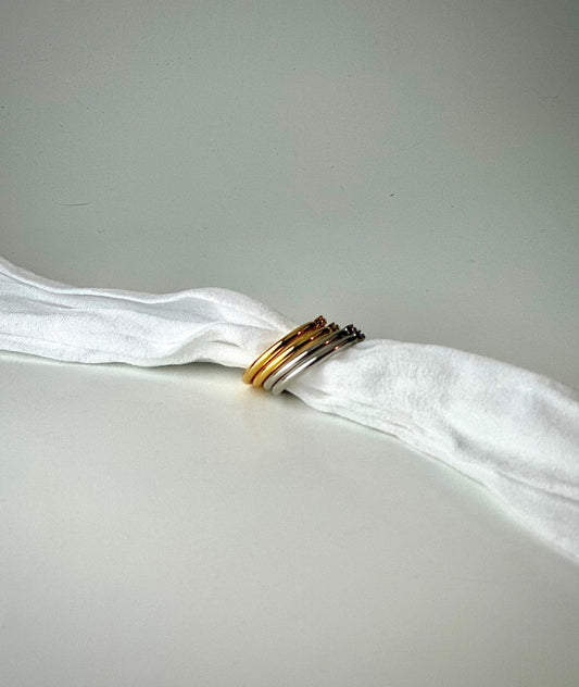 earrings on a white fabric against a gray background - Style A