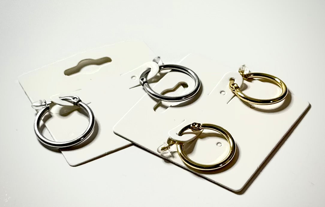 2 Sets of hoop earrings on white background