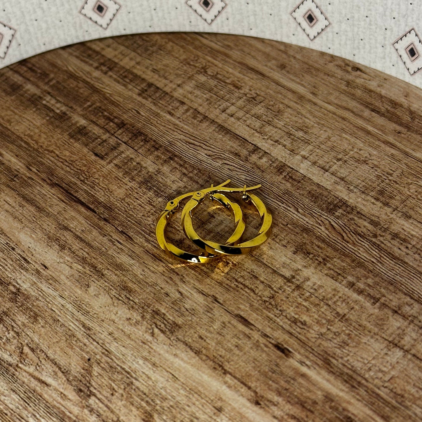 Wooden cutting board with a patterned surface on a white background