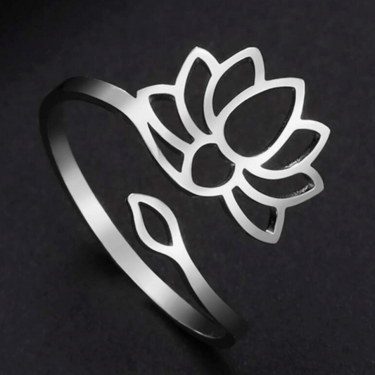 Silver lotus flower ring on a black background