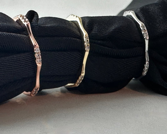 Three rings with CZ accents on a black background